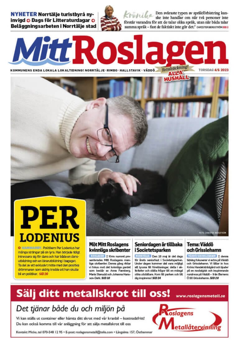 En person som ler och klappar en svart katt på ett bord, under rubriken "Per Lodenius", med datumet TORSDAG, MAJ 2023. På sidan visas olika nyhetsartiklar och annonser under banderollen "Mitt Roslagen.